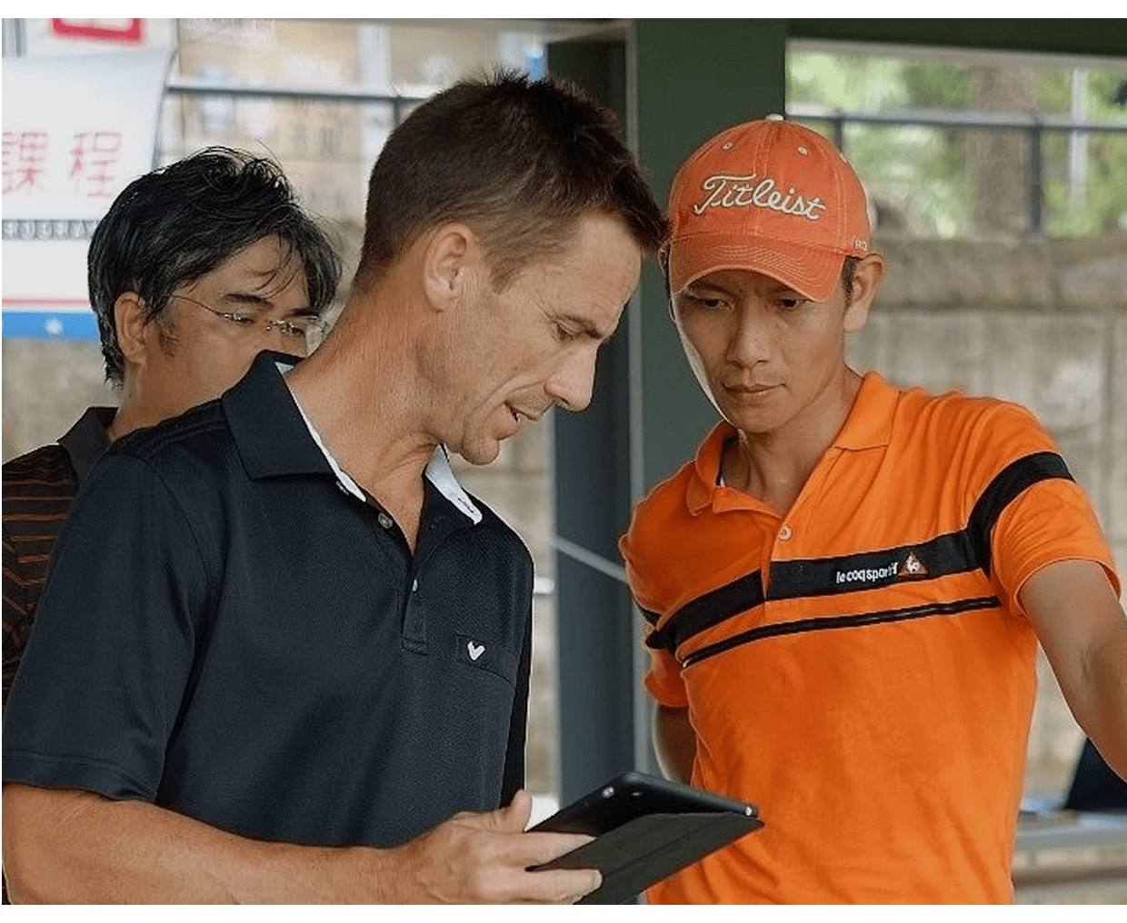 Group reviewing information on tablet